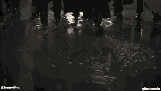 a group of men in suits are walking down a street with sunnywing written on the bottom of the image