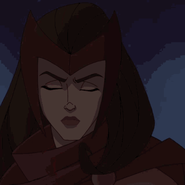 a close up of a scarlet witch 's face with a red light coming out of it