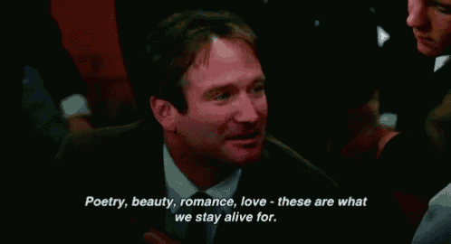 a man in a suit and tie is talking about poetry beauty and romance