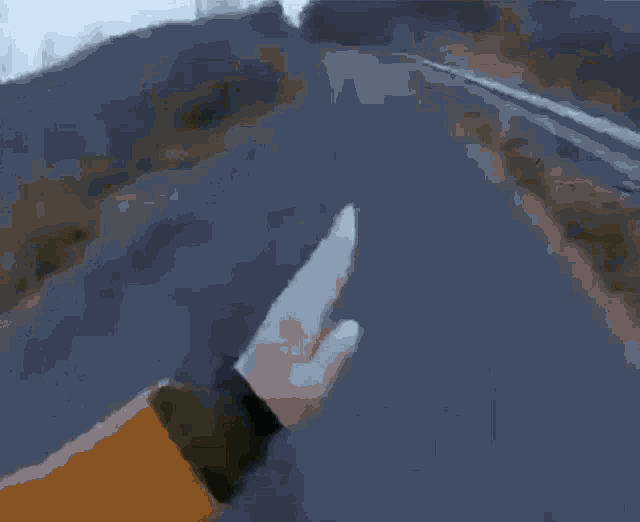 a person is jumping off a cliff into a lake .