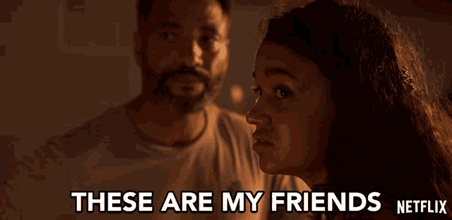a man and a woman are standing next to each other with the words " these are my friends " on the bottom