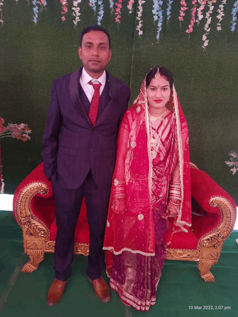 a man and a woman pose for a photo on march 10th 2022