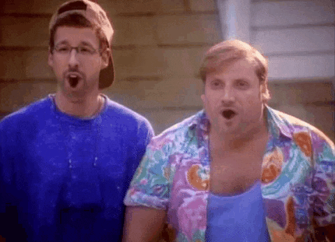 two men are standing next to each other with their mouths open . one of the men is wearing a colorful shirt .