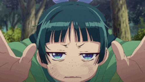 a girl with green hair and blue eyes looks angry