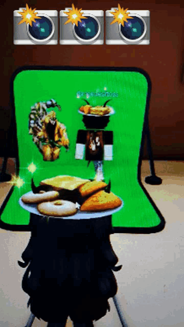 three cameras are taking a picture of a plate of food with a green screen in the background that says ' kay elizabeth '