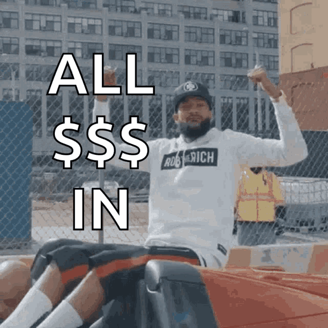 a man sitting in a car with his fist in the air and the words all dollars in
