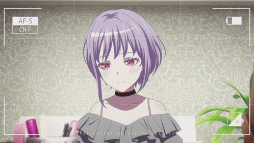 a girl with purple hair and red eyes is being filmed with the af-s off setting