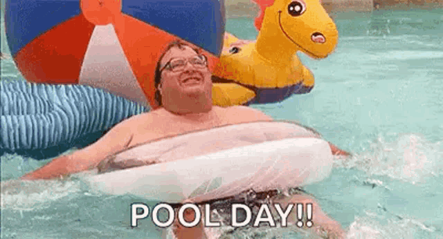 a man is swimming in a pool with a life preserver .