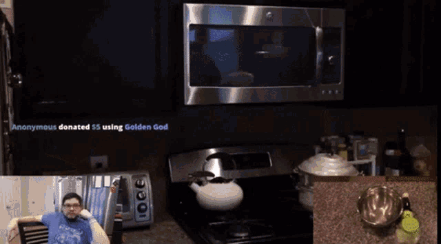 a man sitting in front of a microwave with the words " anonymous donated $ 5 using golden god "