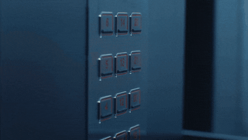 a woman is holding an ice cream cone in front of an elevator with the numbers 4 and 12 on it