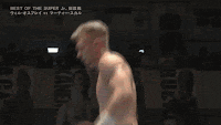 two men are wrestling in a ring with the words best of the super j. on the bottom left