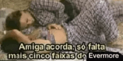 a man and a woman are laying on a bed with a caption that says amiga acorda