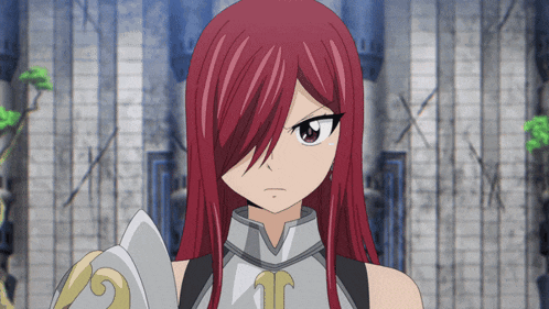 a girl with red hair is wearing a knight 's outfit and holding a shield
