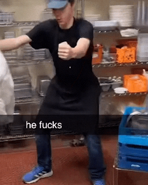 a man in an apron is dancing in a kitchen with the words he fucks written on the bottom