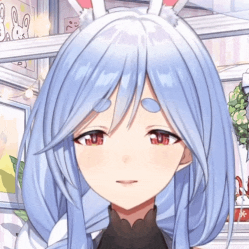 a close up of a girl 's face with blue hair and bunny ears
