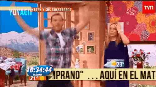 a tv screen shows a man and a woman dancing in front of a sign that says prano aqui en el mat