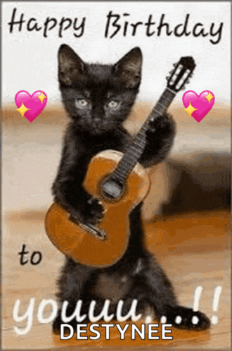 a black kitten is holding a guitar in its paws on a birthday card