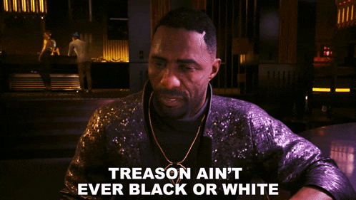 a man in a purple jacket with the words treason ain 't ever black or white below him
