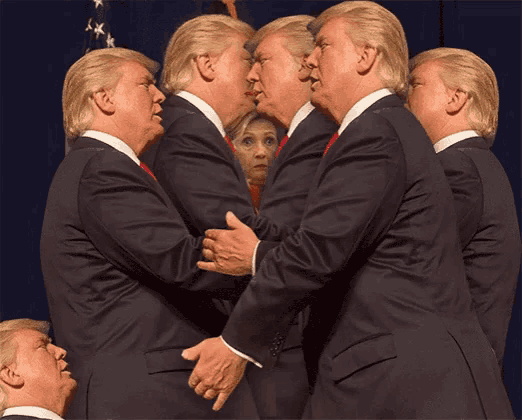 a man in a suit is standing in front of a mirror