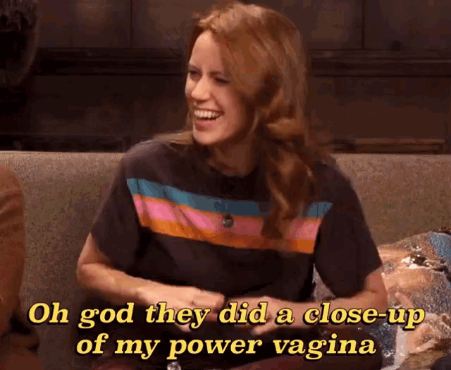 a woman is sitting on a couch and laughing with the words oh god they did a close up of my power vagina