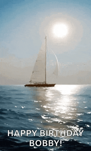 a sailboat in the ocean with the sun shining on it