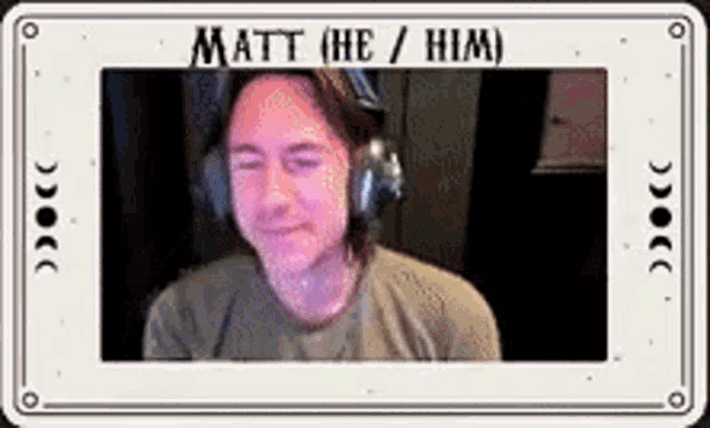 a man wearing headphones is sitting in front of a screen with the name matt on it .