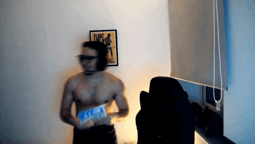 a man without a shirt is standing in front of a poster that says " float "