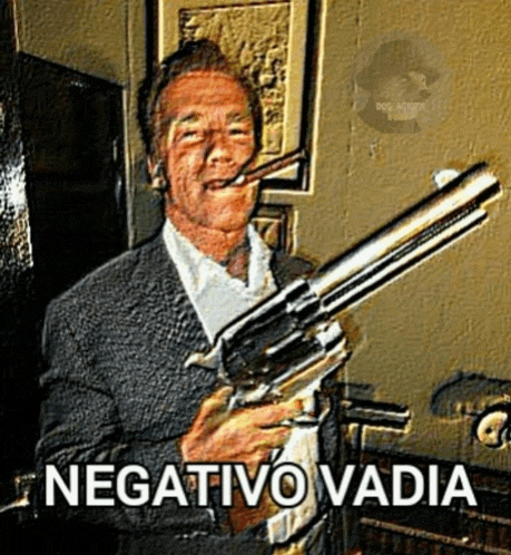 a man in a suit is smoking a cigar and holding a large gun .