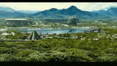 a large body of water is surrounded by mountains and trees