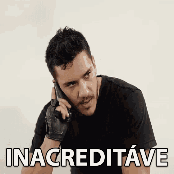 a man is talking on a cell phone and the word inacreditave is on the screen