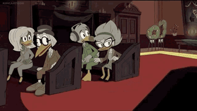 a group of cartoon ducks are sitting in a room .