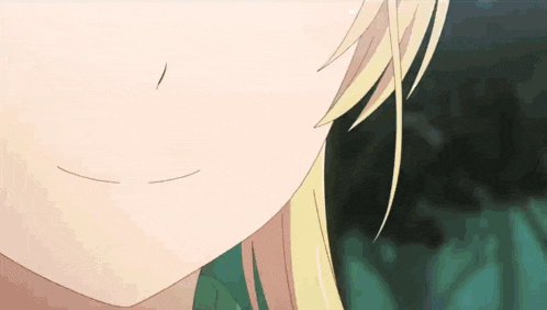 a close up of a blonde anime girl 's face with a smile on her face