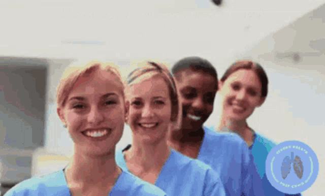 a group of nurses are smiling in front of a sign that says " nurses without borders "