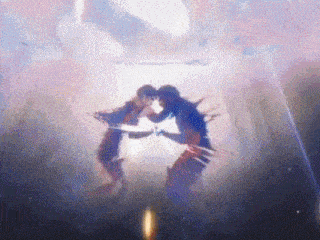 a couple of people are standing next to each other in a dark room