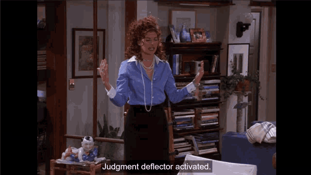a woman standing in a living room with the words judgment deflector activated on the screen