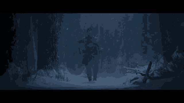 a man is running through a snowy forest at night