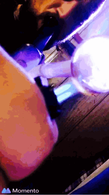 a momento app shows a man smoking a pipe