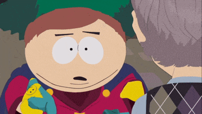 a cartoon character from south park is smiling and holding a toy