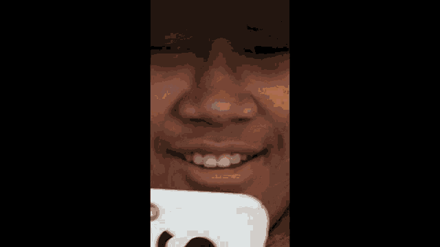 a close up of a person eating a chip