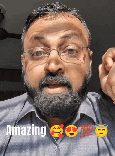 a man with glasses and a beard has the words amazing above him