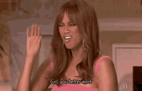 a woman in a pink dress is holding her hand to her head and saying `` girl , you better work '' .