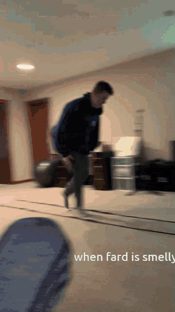 a man is jumping in the air in a room with the words when fard is smelly below him