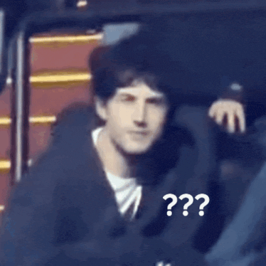 a person sitting in a chair with a question mark on the back of their head