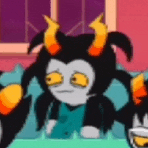 a cartoon character with horns is sitting on a couch and making a face .