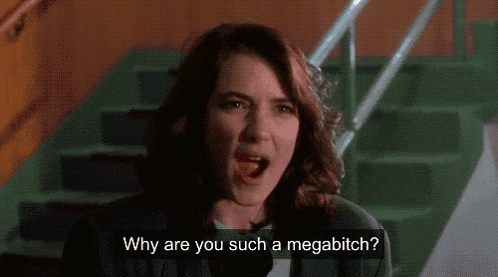 a woman is screaming with the words why are you such a megabitch below her