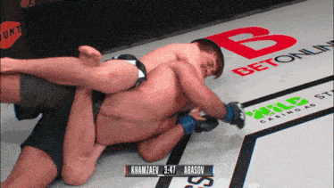 a wrestling match between khamzaev and abasov with the score of 3:47
