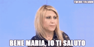 a woman is saying bene maria io ti saluto in a foreign language .