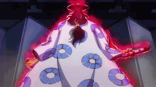 a person in a kimono holding a sword with circles on the back