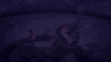 a video game character is fighting a monster in a purple room