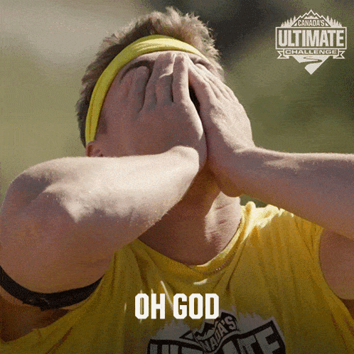 a man covering his face with his hands in front of a canada 's ultimate challenge poster